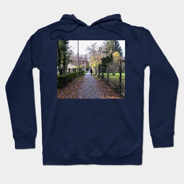 Girl walking in distance in a park on a sunny day Hoodie by KargacinArt